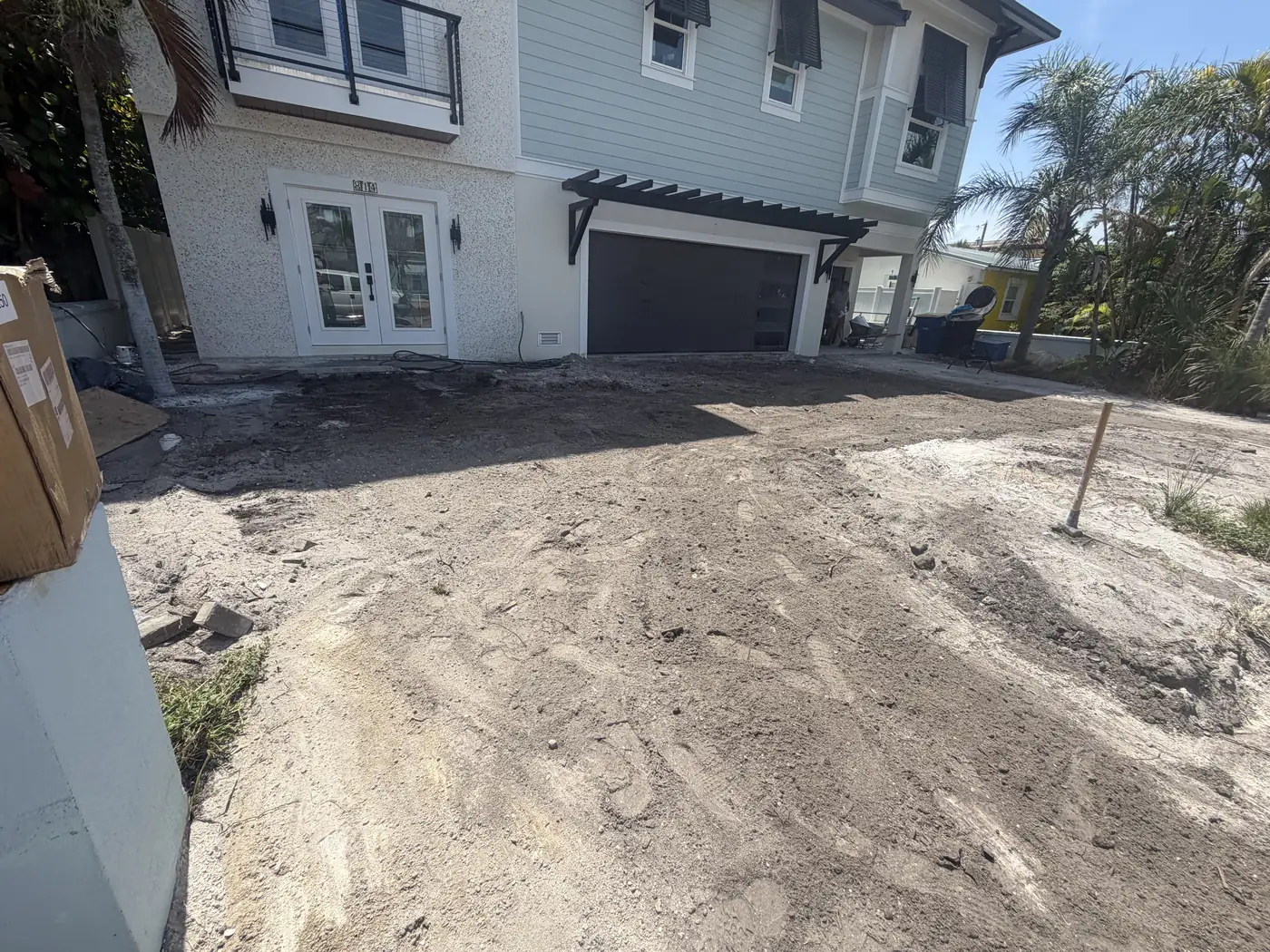 Coastal home driveway excavated and graded before paver installation